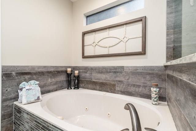 bathroom featuring tiled bath