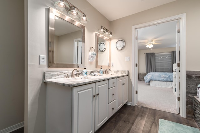 bathroom featuring wood-type flooring, vanity, and ceiling fan