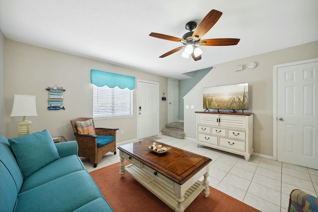 living room with ceiling fan and light tile patterned floors