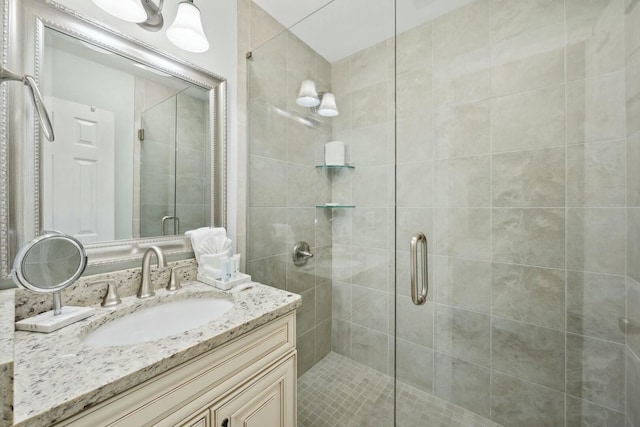 bathroom with vanity and walk in shower