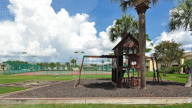 view of play area featuring tennis court