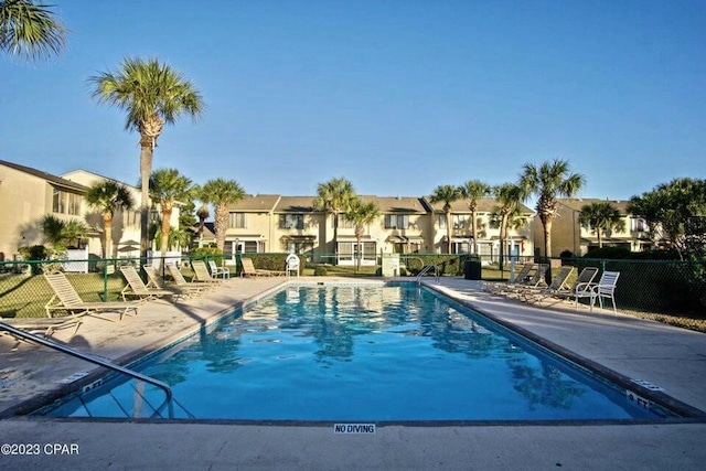 view of swimming pool with a patio area