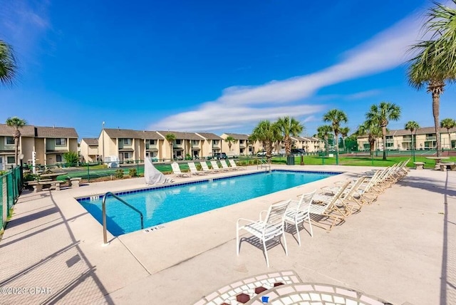 view of swimming pool with a patio area