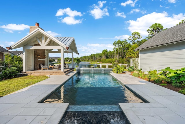 view of swimming pool with a hot tub and a patio