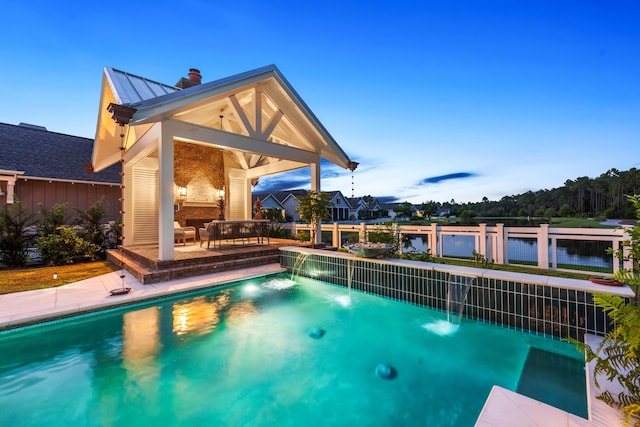 pool at dusk with a water view