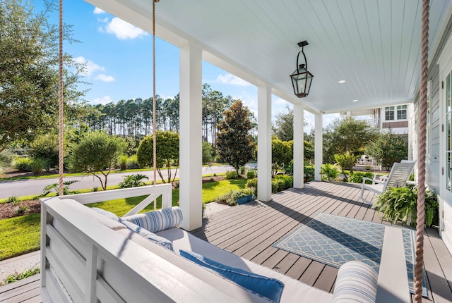 wooden deck featuring outdoor lounge area