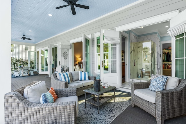 sunroom featuring ceiling fan