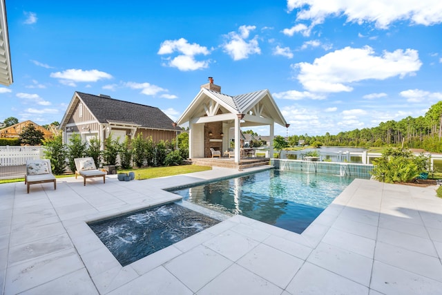 view of pool featuring an outbuilding, an outdoor fireplace, and a patio