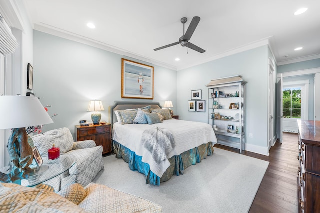 bedroom with ceiling fan, ornamental molding, and dark hardwood / wood-style flooring