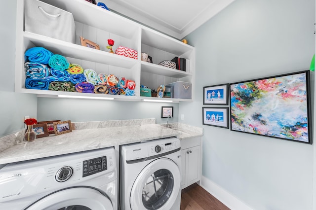 washroom with cabinets, ornamental molding, separate washer and dryer, and dark wood-type flooring