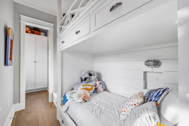 bedroom with hardwood / wood-style flooring