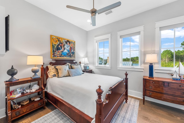 bedroom featuring hardwood / wood-style flooring and ceiling fan