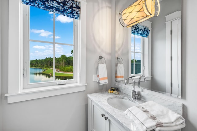 bathroom featuring vanity and a water view