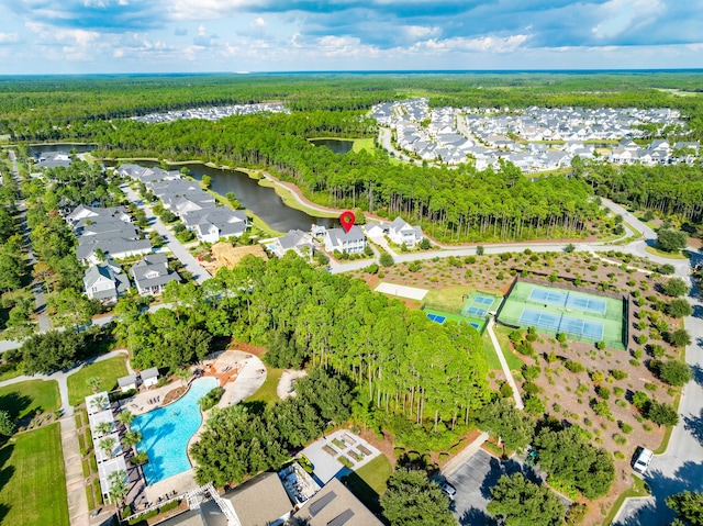 birds eye view of property with a water view