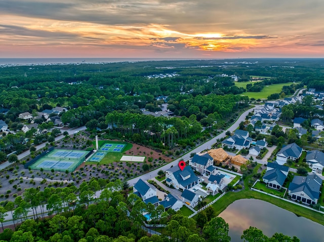 aerial view at dusk with a water view