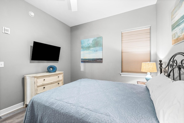 bedroom featuring ceiling fan and dark hardwood / wood-style floors