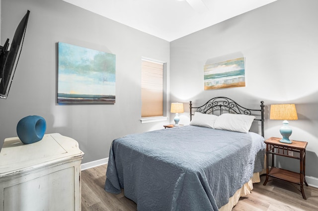 bedroom with light hardwood / wood-style flooring