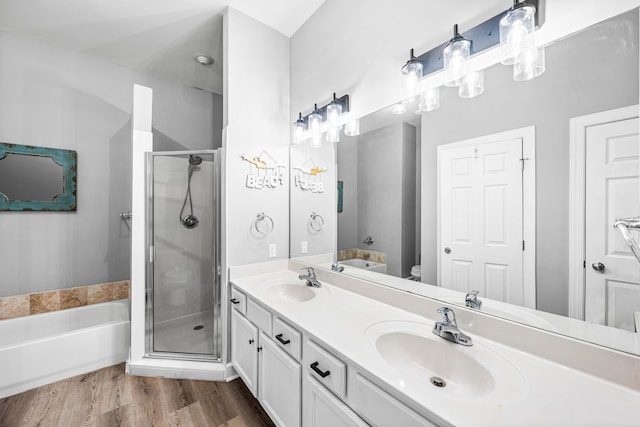 full bathroom featuring vanity, plus walk in shower, wood-type flooring, and toilet