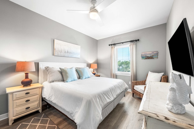 bedroom featuring ceiling fan and dark wood-type flooring