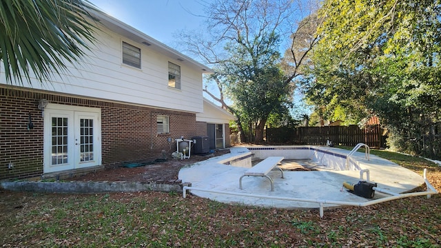 view of pool featuring french doors and a patio