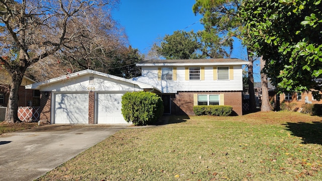 view of front of property with a garage and a front lawn