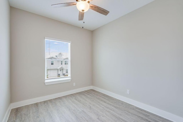 unfurnished room with ceiling fan and light wood-type flooring