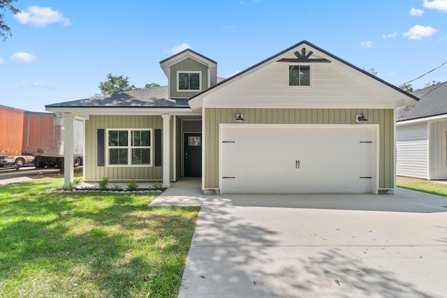 view of front facade with a front yard and a garage