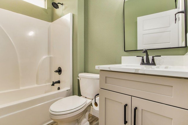 full bathroom featuring vanity, toilet, shower / bath combination, and wood-type flooring