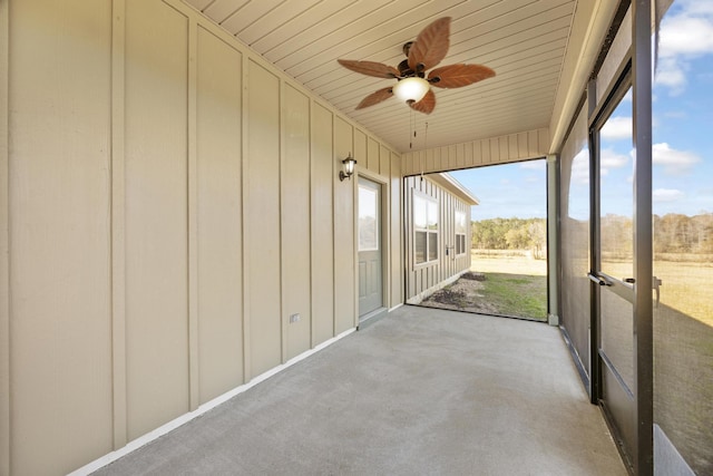 unfurnished sunroom with wood ceiling