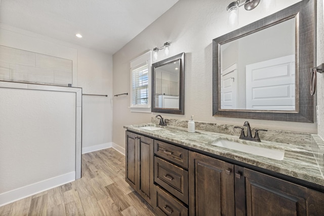 bathroom with hardwood / wood-style floors and vanity