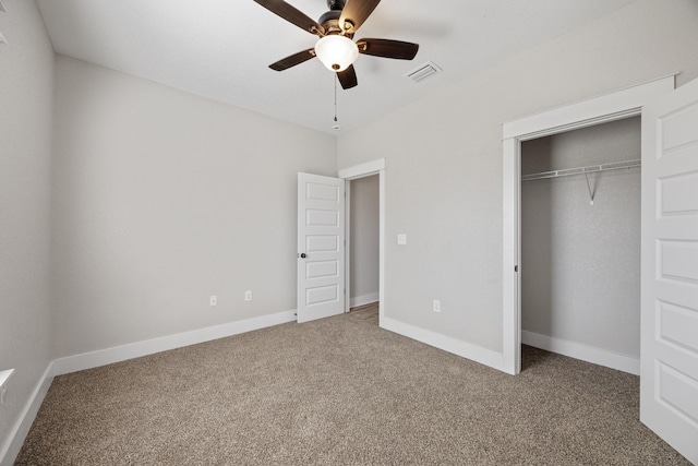 unfurnished bedroom with carpet flooring, ceiling fan, and a closet