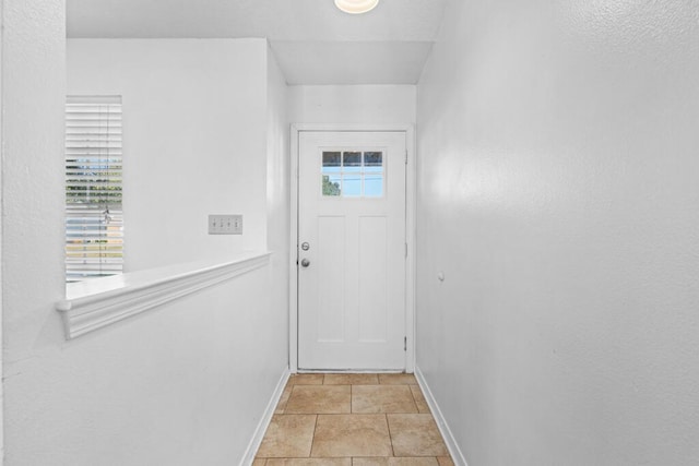 doorway featuring light tile patterned floors