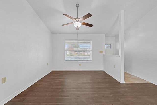 spare room featuring dark hardwood / wood-style floors and ceiling fan