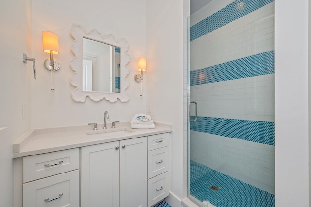 bathroom with vanity and an enclosed shower