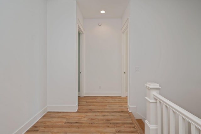 corridor featuring light hardwood / wood-style floors