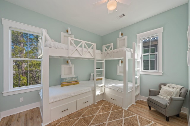 bedroom with ceiling fan and hardwood / wood-style floors