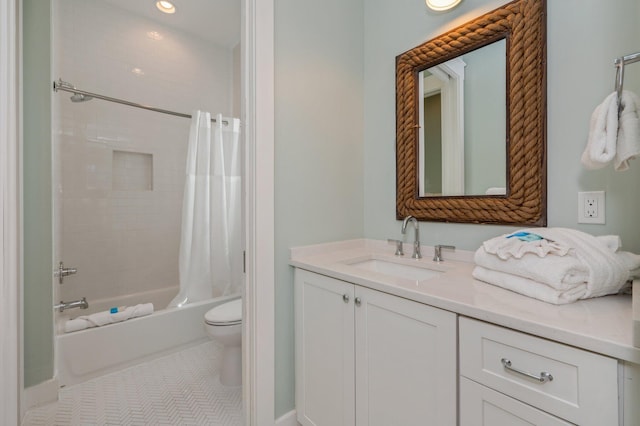 full bathroom featuring tile patterned flooring, vanity, toilet, and shower / tub combo