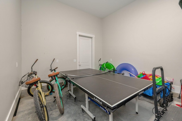 rec room featuring concrete flooring