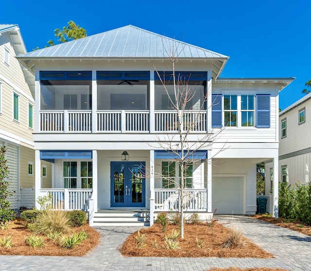 view of front of home with covered porch and a garage