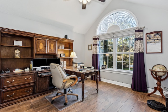 office area featuring lofted ceiling, dark hardwood / wood-style floors, a wealth of natural light, and ceiling fan