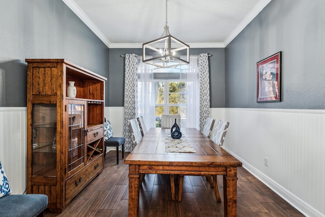 dining area featuring a notable chandelier, crown molding, and dark hardwood / wood-style floors