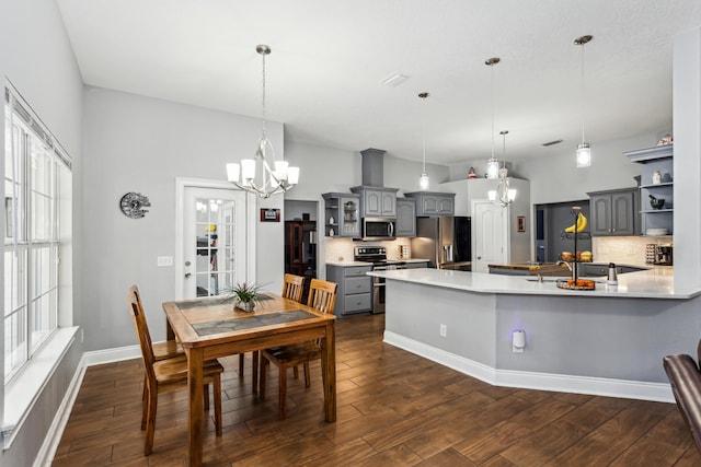 dining area with a notable chandelier and dark wood-type flooring