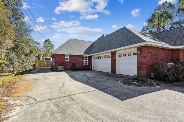 view of home's exterior featuring central AC and a garage