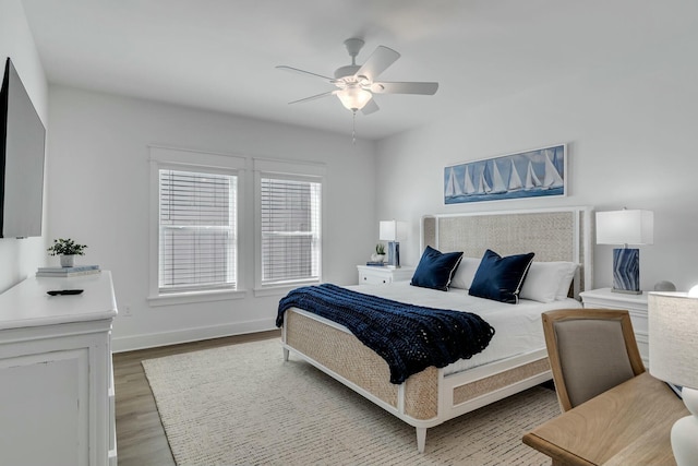 bedroom featuring ceiling fan and wood-type flooring