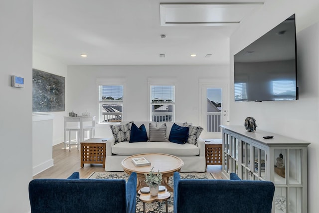 living room with light hardwood / wood-style floors