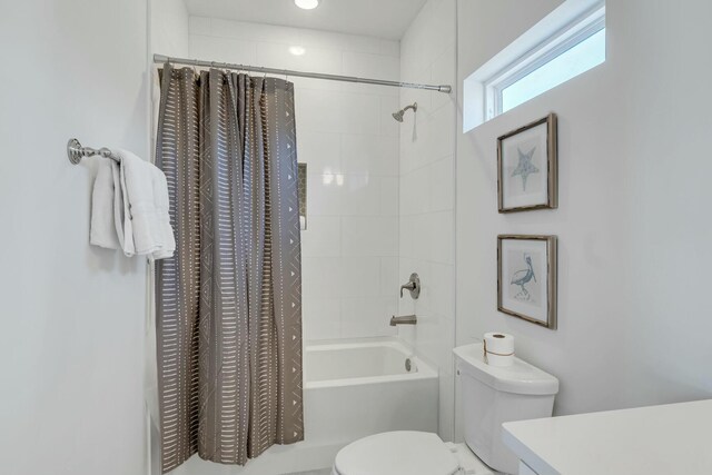 full bathroom with vanity, toilet, and shower / bathtub combination with curtain