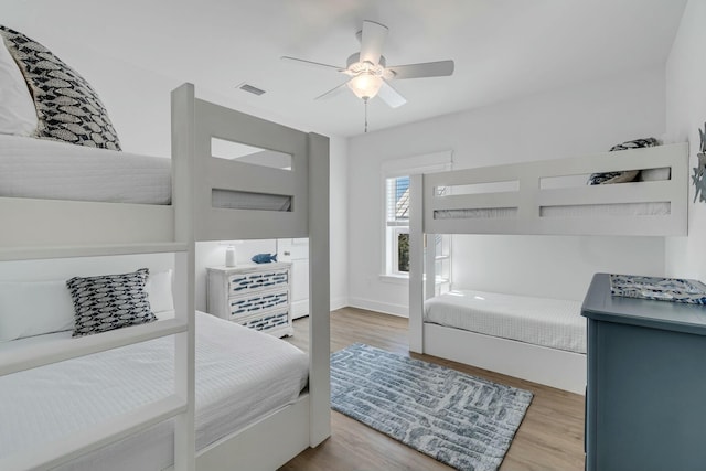 bedroom featuring ceiling fan and light hardwood / wood-style floors