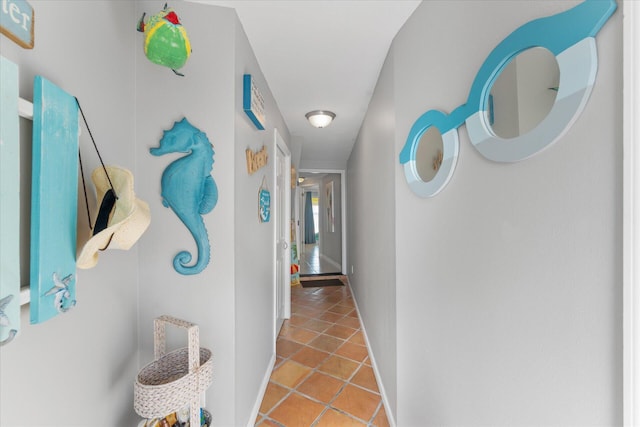 hallway featuring light tile patterned floors