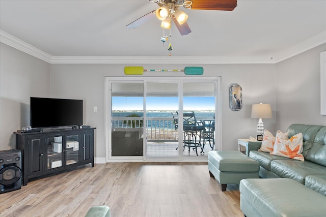 living room with ceiling fan, light wood-type flooring, and ornamental molding