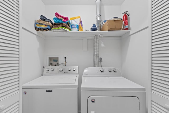 washroom with independent washer and dryer